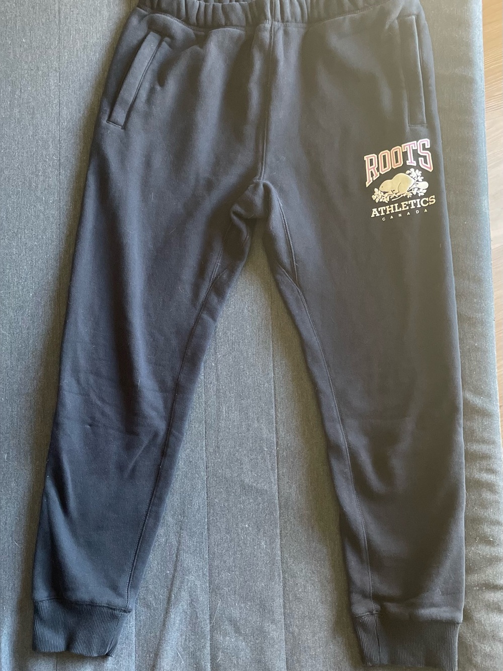 Roots Athletics black women’s sweatpants with logo zip pockets size small
